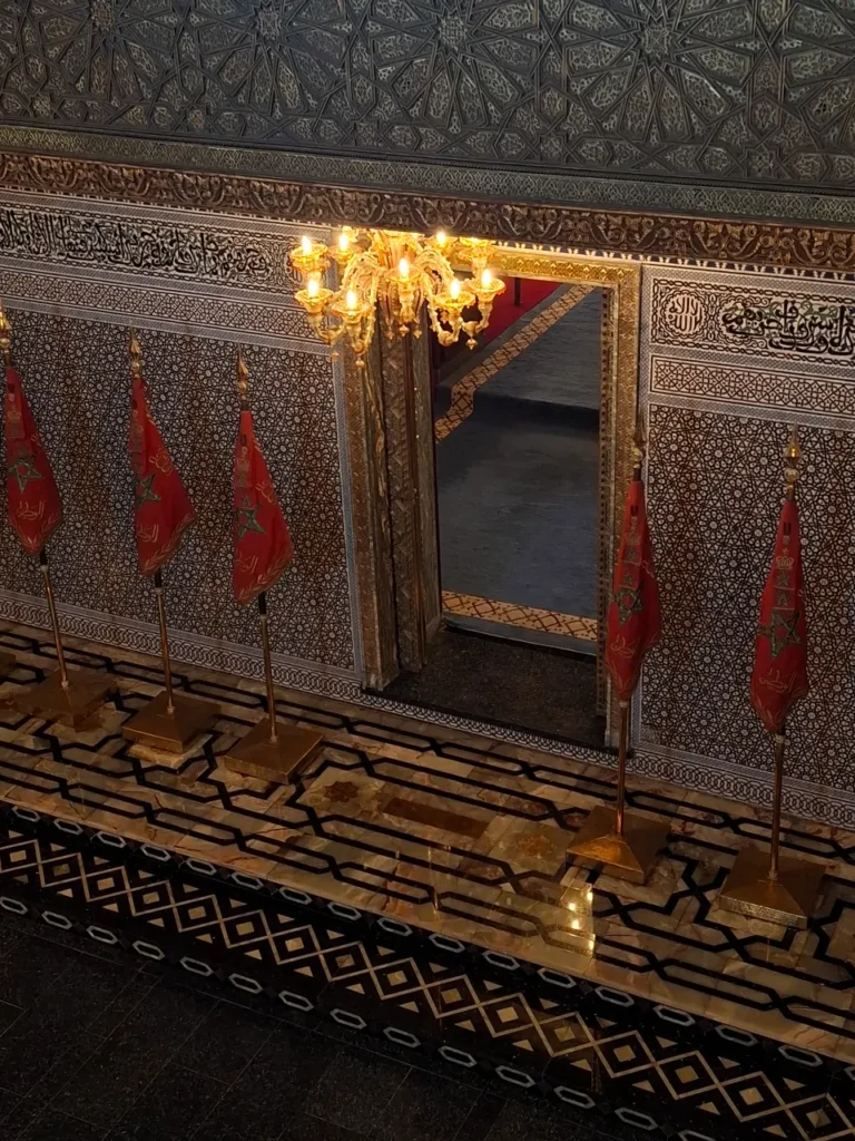 Interior of the Mausoleum Mohammed V in Rabat with Moroccan flags and traditional decoration