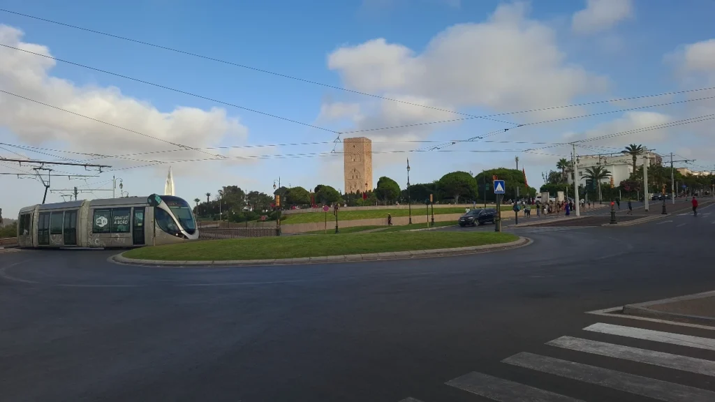 Modern Rabat tramway operating near the historical Hassan Tower, showing how easy it is to navigate a 2-day Rabat itinerary without a car.